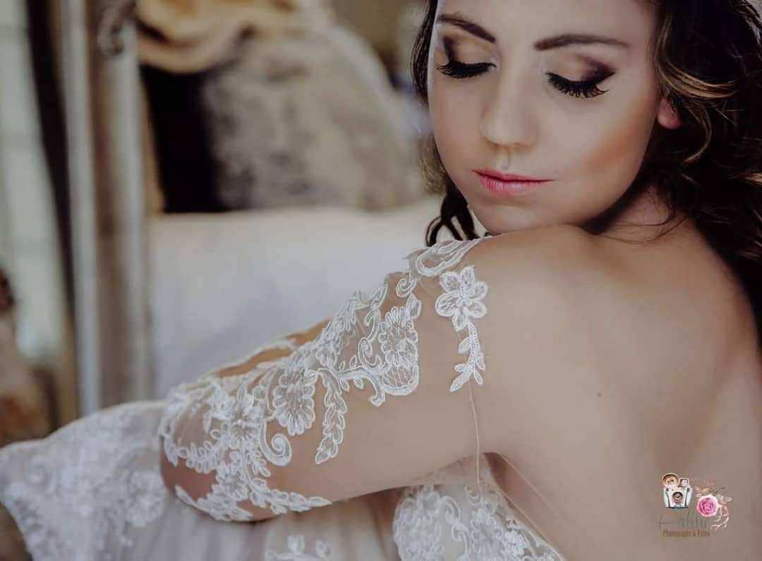 A close-up of a model's eye with a perfectly blended dark smoky eyeshadow look.